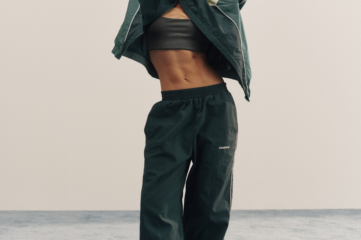 Winter Running cover: a lemon zip running top, navy Nike jacket and navy leggings from the edit